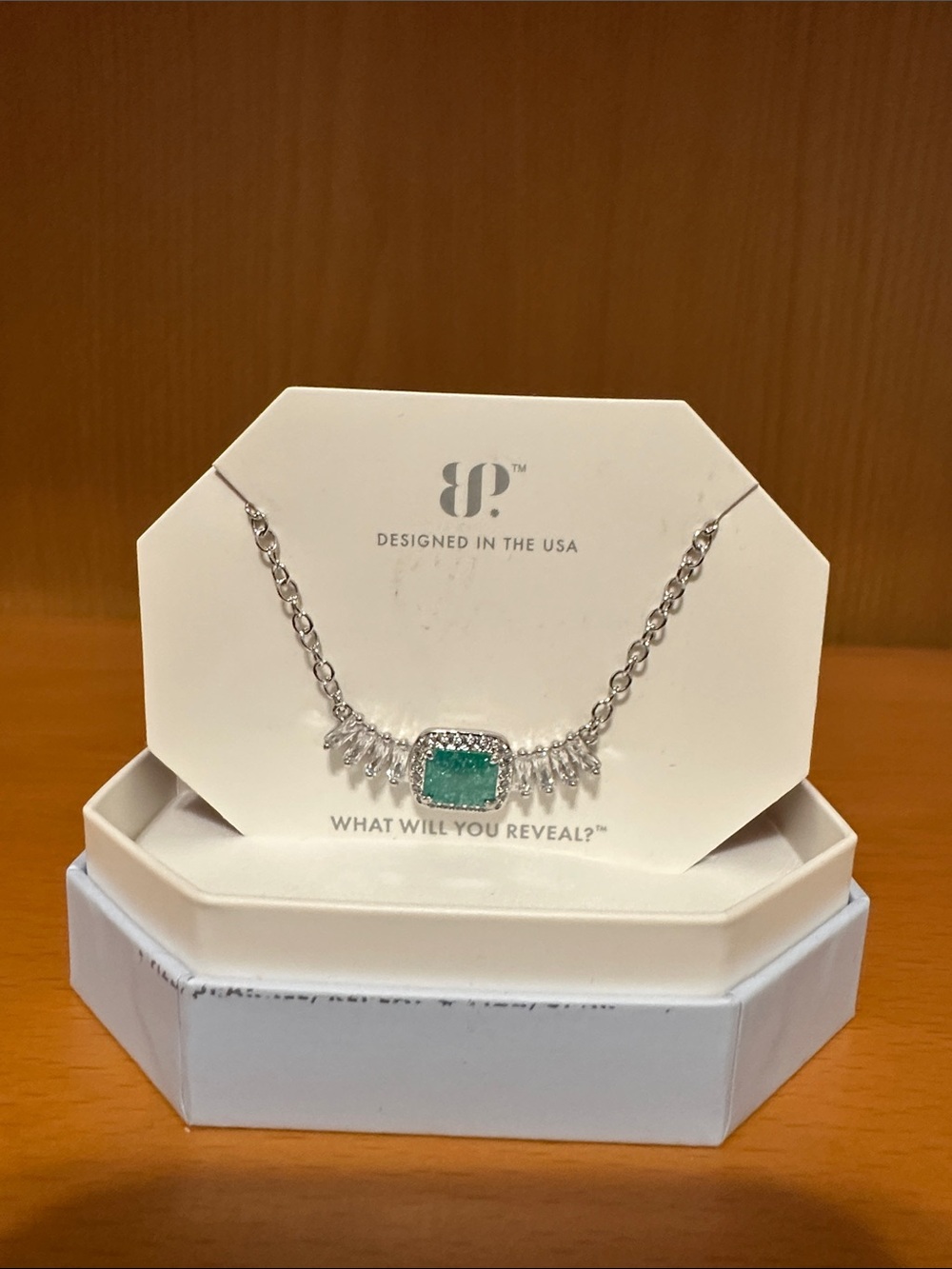 BP necklace.  Main stone: lab created emerald. Rhodium
